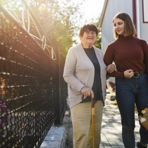 person-helping-their-elder-neighbour