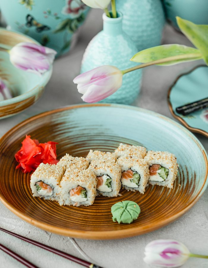 sushi-rolls-with-salmon-cream-cheese-cucuber-covered-with-sesame